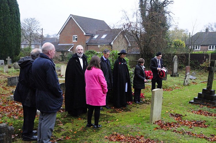 Laying wreaths on graves of war dead at All Saints' Churchyard